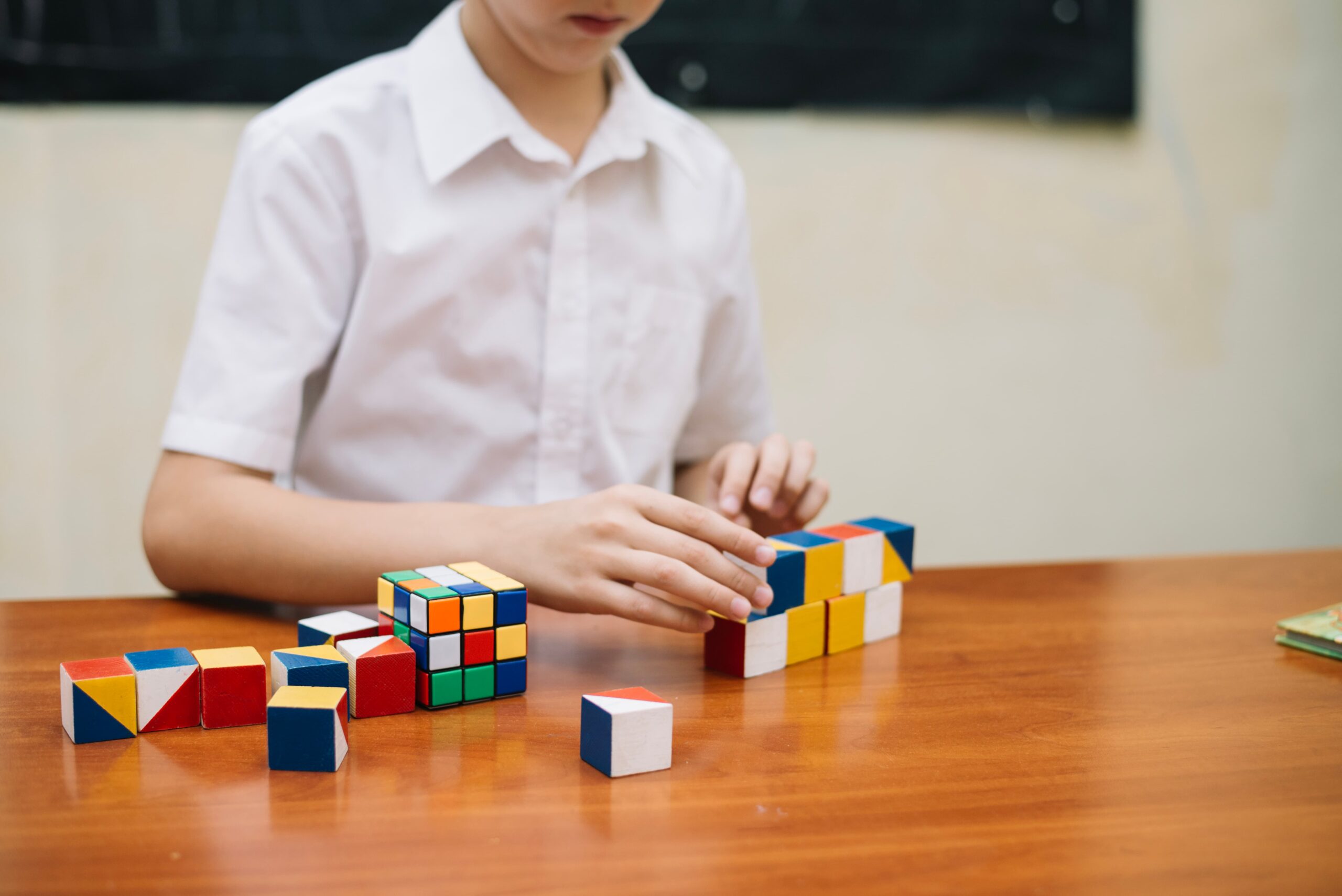 boy playing with puzzle 1 scaled